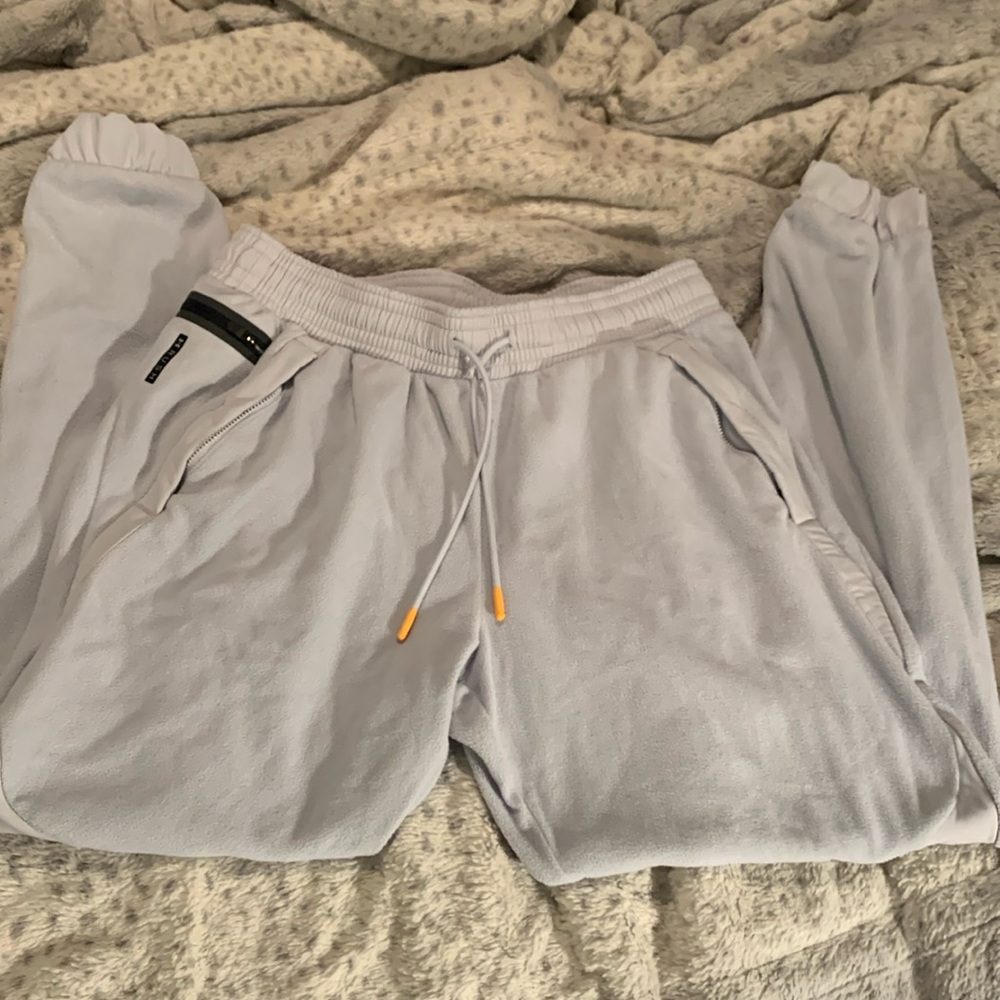 Grey Underarmour fleece joggers with Celliant
Size L